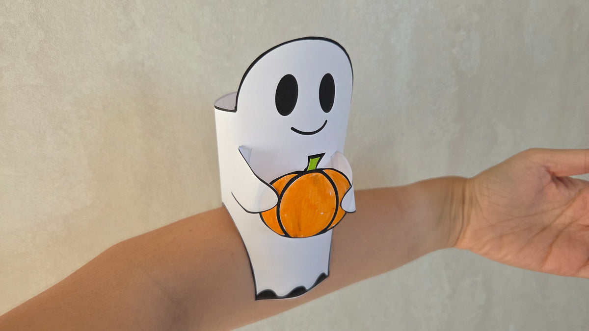 Ghost holding a pumpkin, worn around the wrist – finished Halloween paper craft